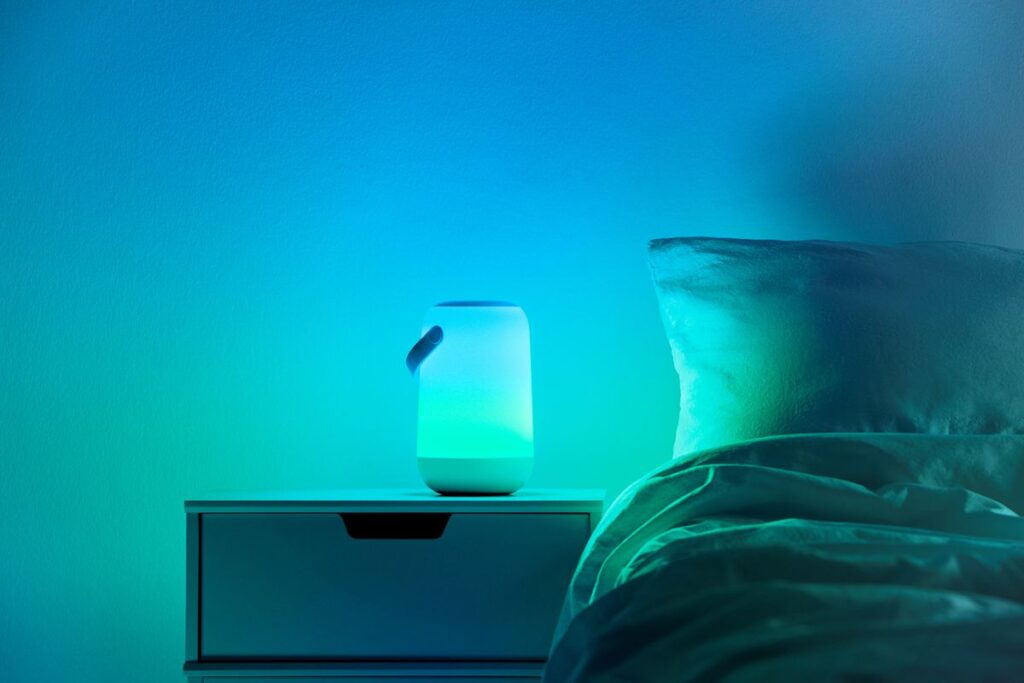 Portable light in use on the bed side table