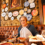 Mrs Doubtfire seating at a table inside Colonel Saab