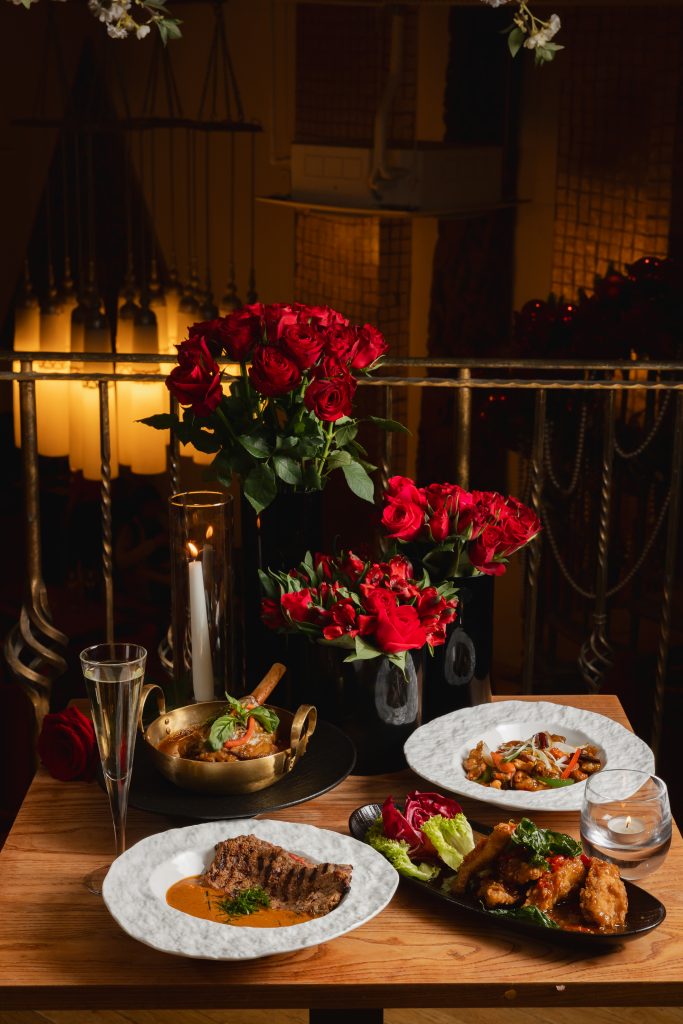 Table spread decorated with 3 bouquets of roses, for Valentine's Day, at Thai Square Minories